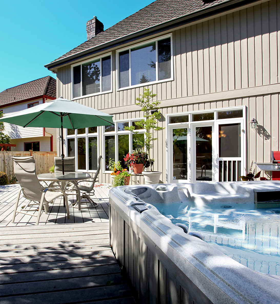 Spa on patio with outdoor landscaping